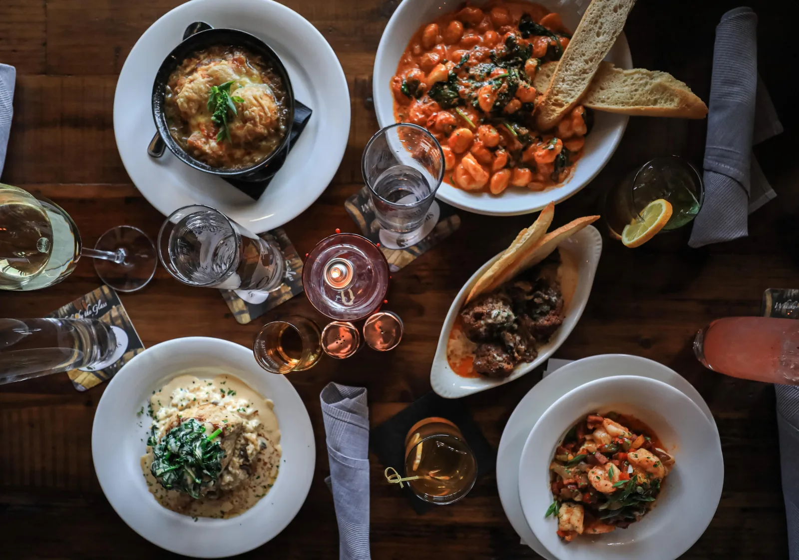Overhead spread of Italian dishes at a farm-to-table Lexington KY restaurant