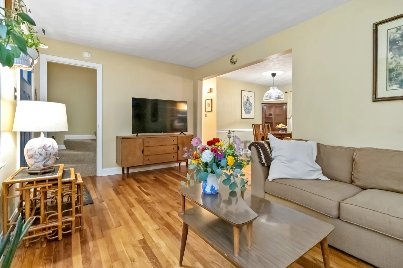 Bright, move-in-ready living room with hardwood floors, staged for sale in Lexington