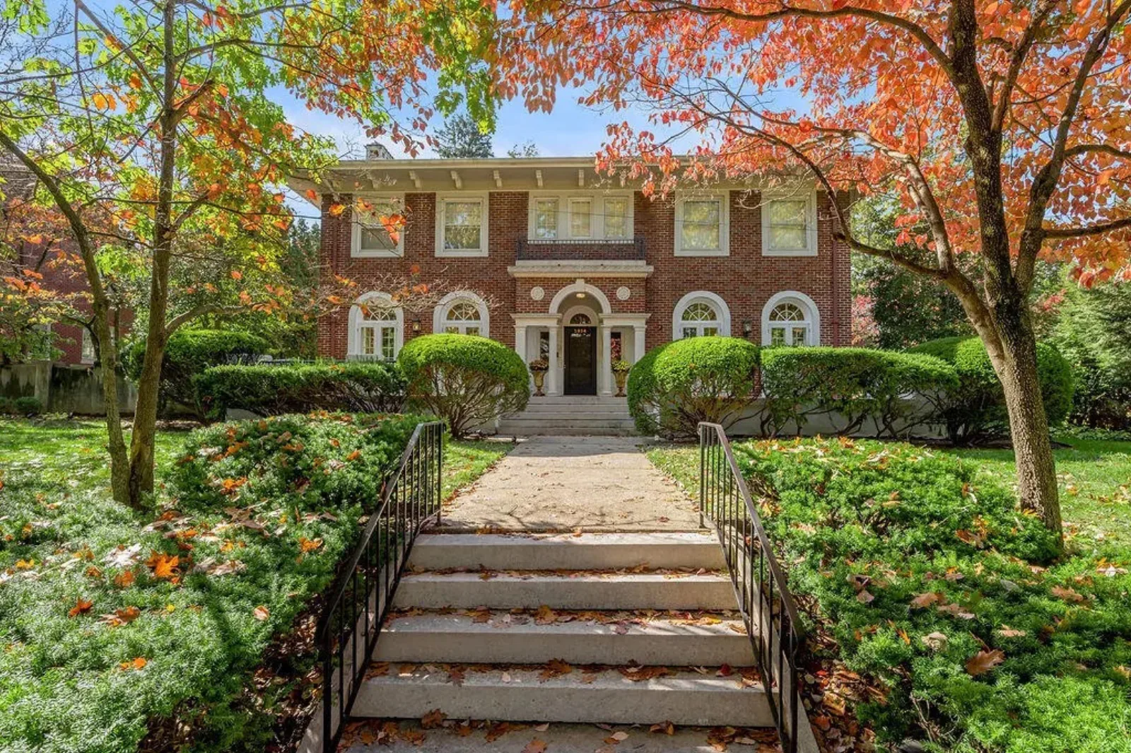 Stately two-story brick home in Lexington KY framed by fall foliage, an older home where inspection findings shape the negotiation