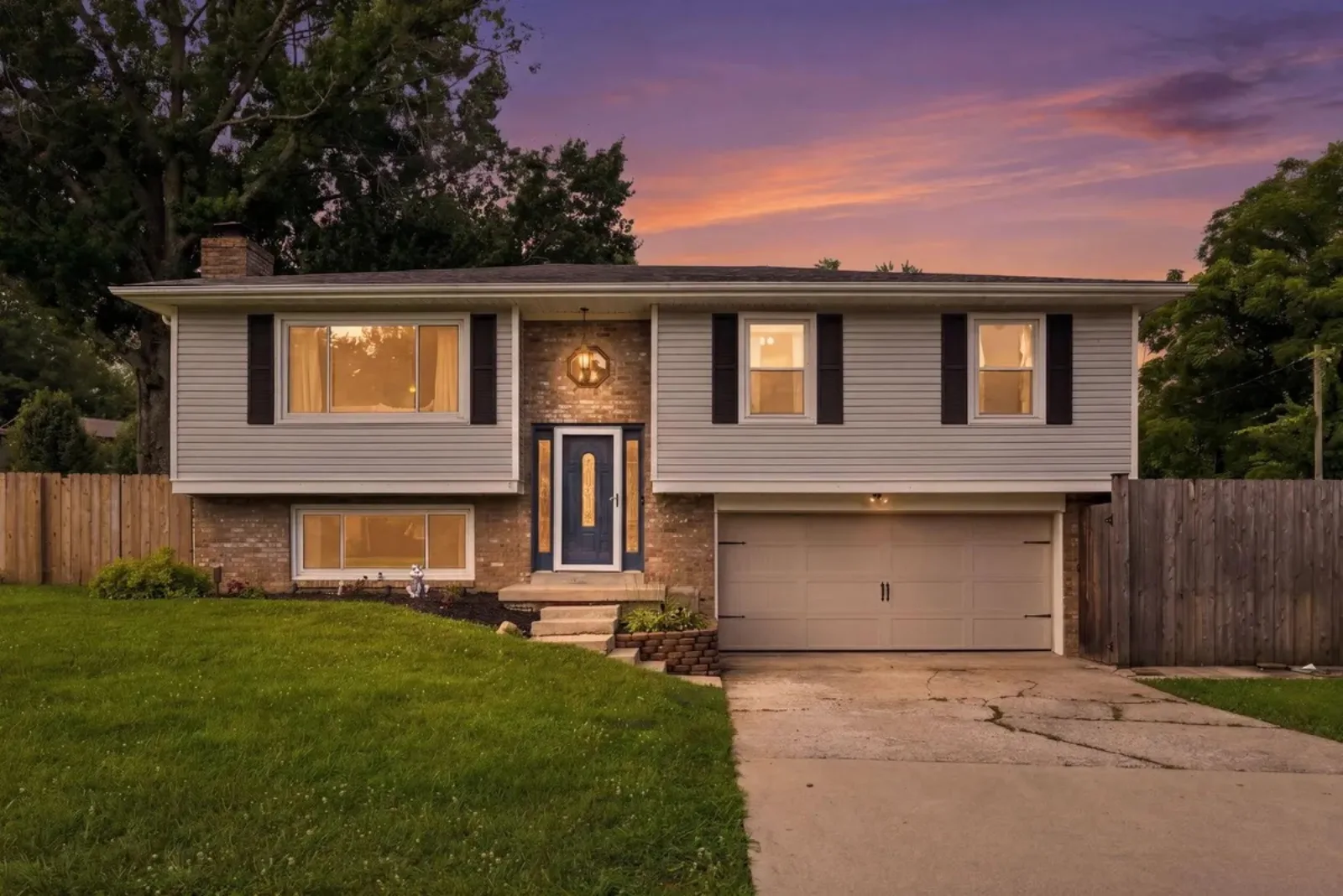 Lexington KY split-level home lit at dusk, the kind of house buyers tour after getting pre-approved for a mortgage