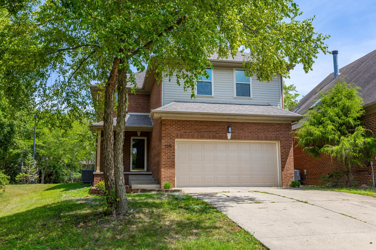 Two-story brick home for sale in Lexington KY's Palomar neighborhood — summer housing market