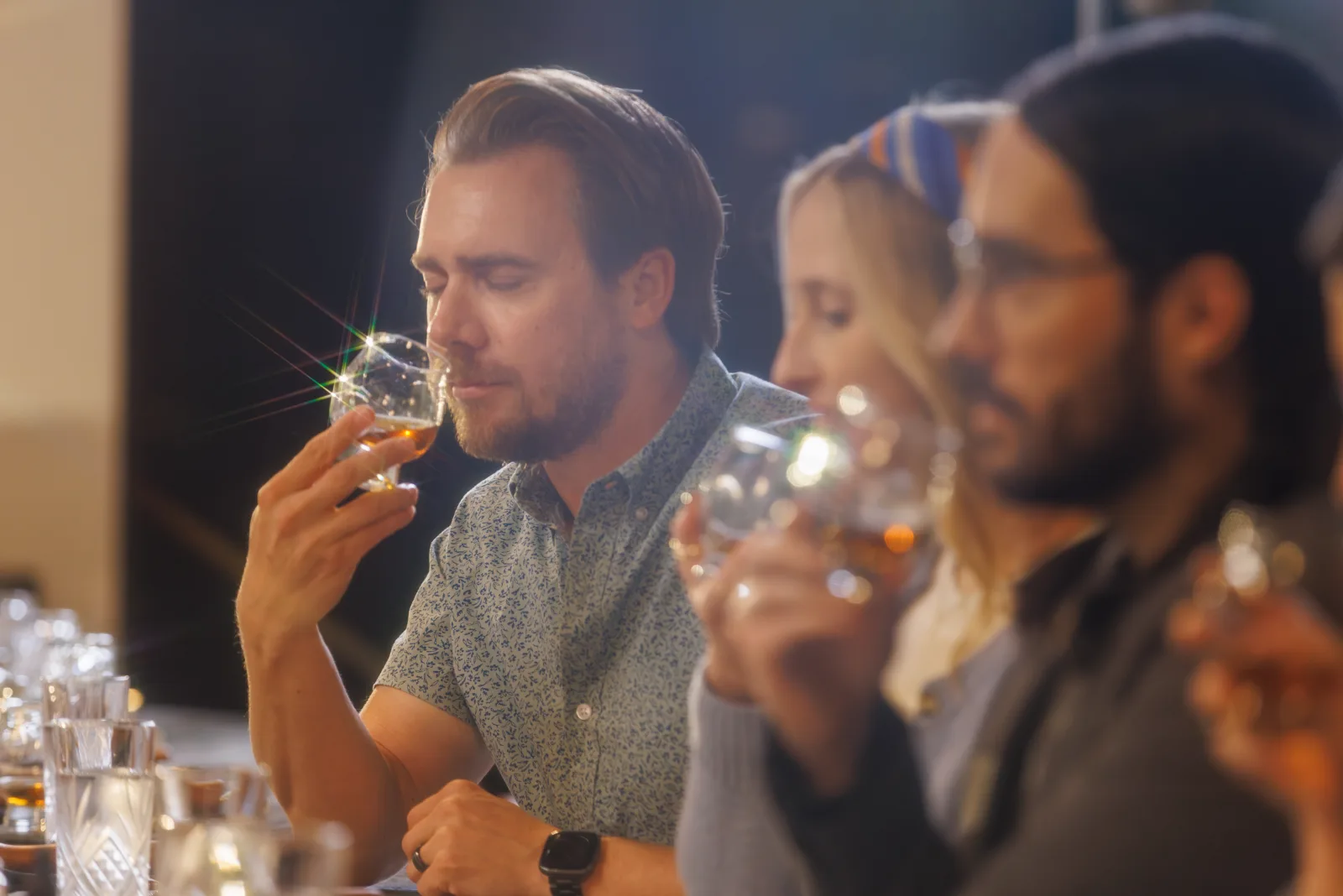 A guided bourbon tasting in Lexington — nosing a glass at the tasting bar