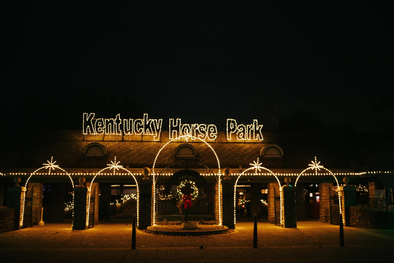 The Kentucky Horse Park entrance outlined in holiday lights during Southern Lights near Lexington KY